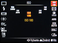 Výběr funkce a úprava hodnoty pomocí zadního křížového voliče